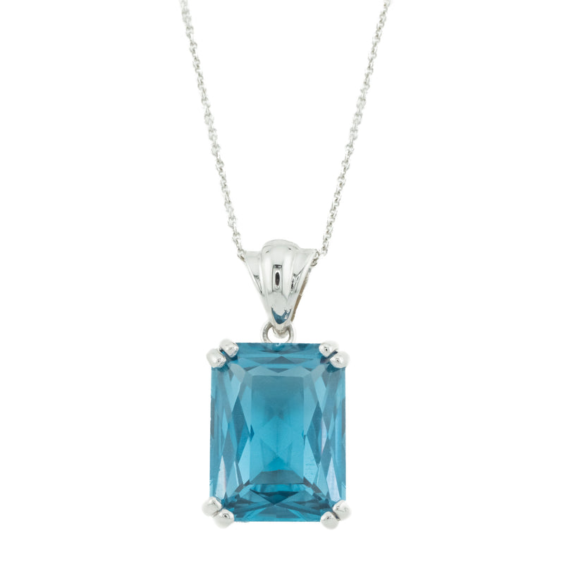 17.56ct Emerald Cut Blue Topaz Pendant in 18K White Gold on 18" Cable Chain in 14K White Gold