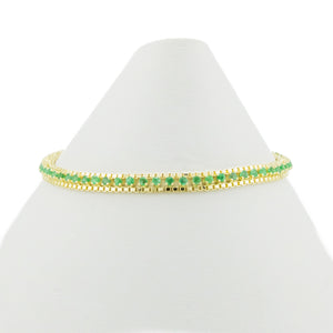 0/90ctw Round Emerald Gemstone Accented 7" Tennis Bracelet in 14K Yellow Gold - 8.5 Grams