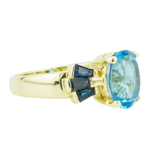 2.50ctw Oval Blue Topaz & Accented Ring in 14K Yellow Gold - Size 6.75